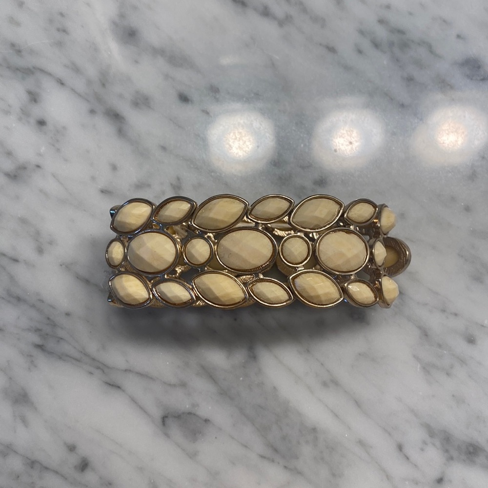 Cream and gold color bracelet